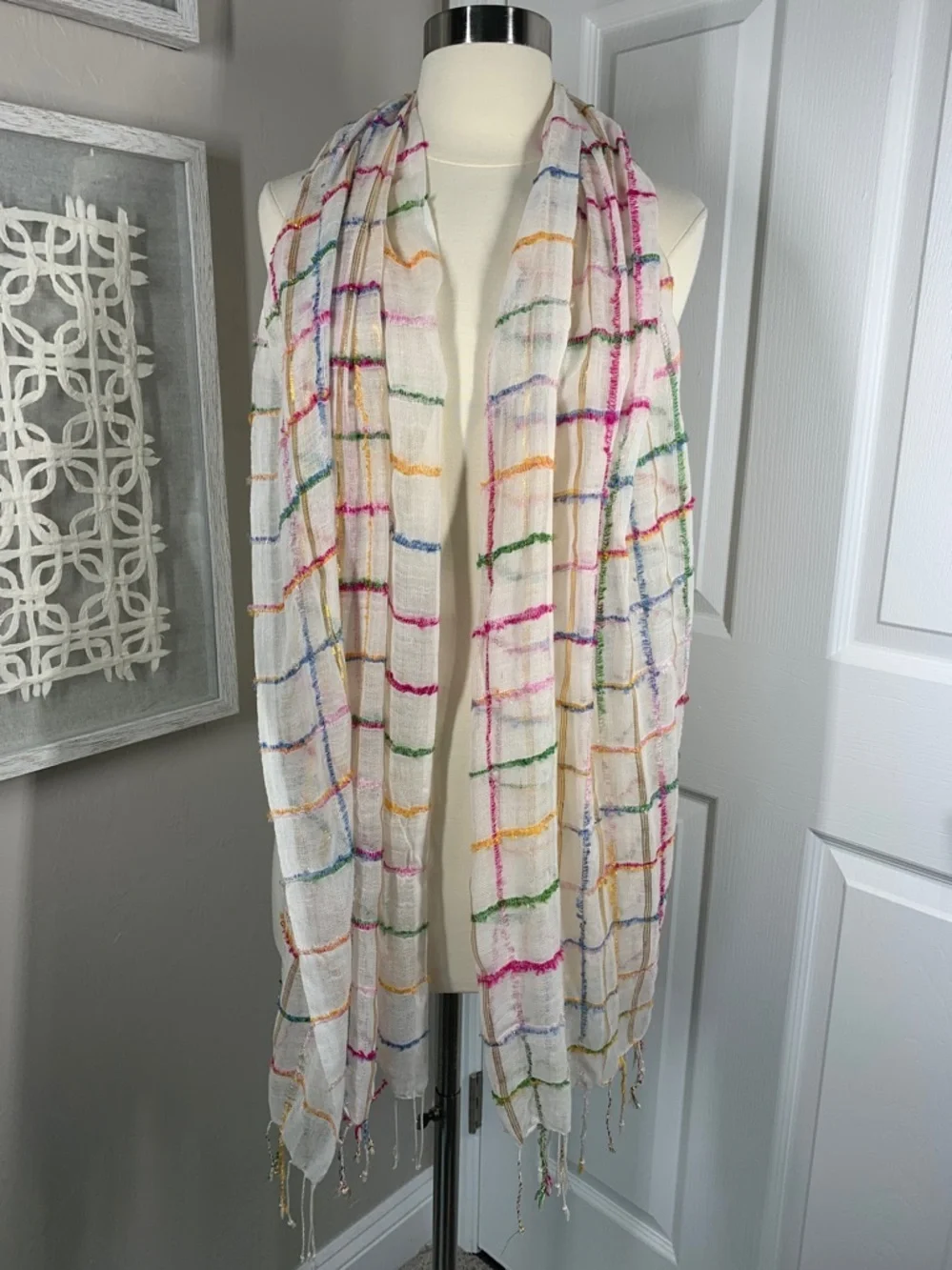 White, metallic gold, pink, blue, and green scarf with fringe